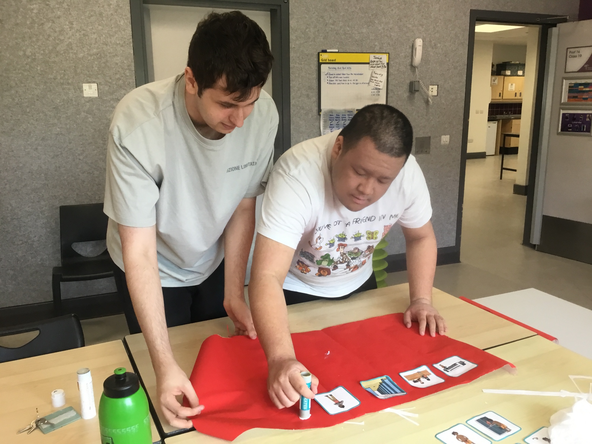 Two students completing an art activity 