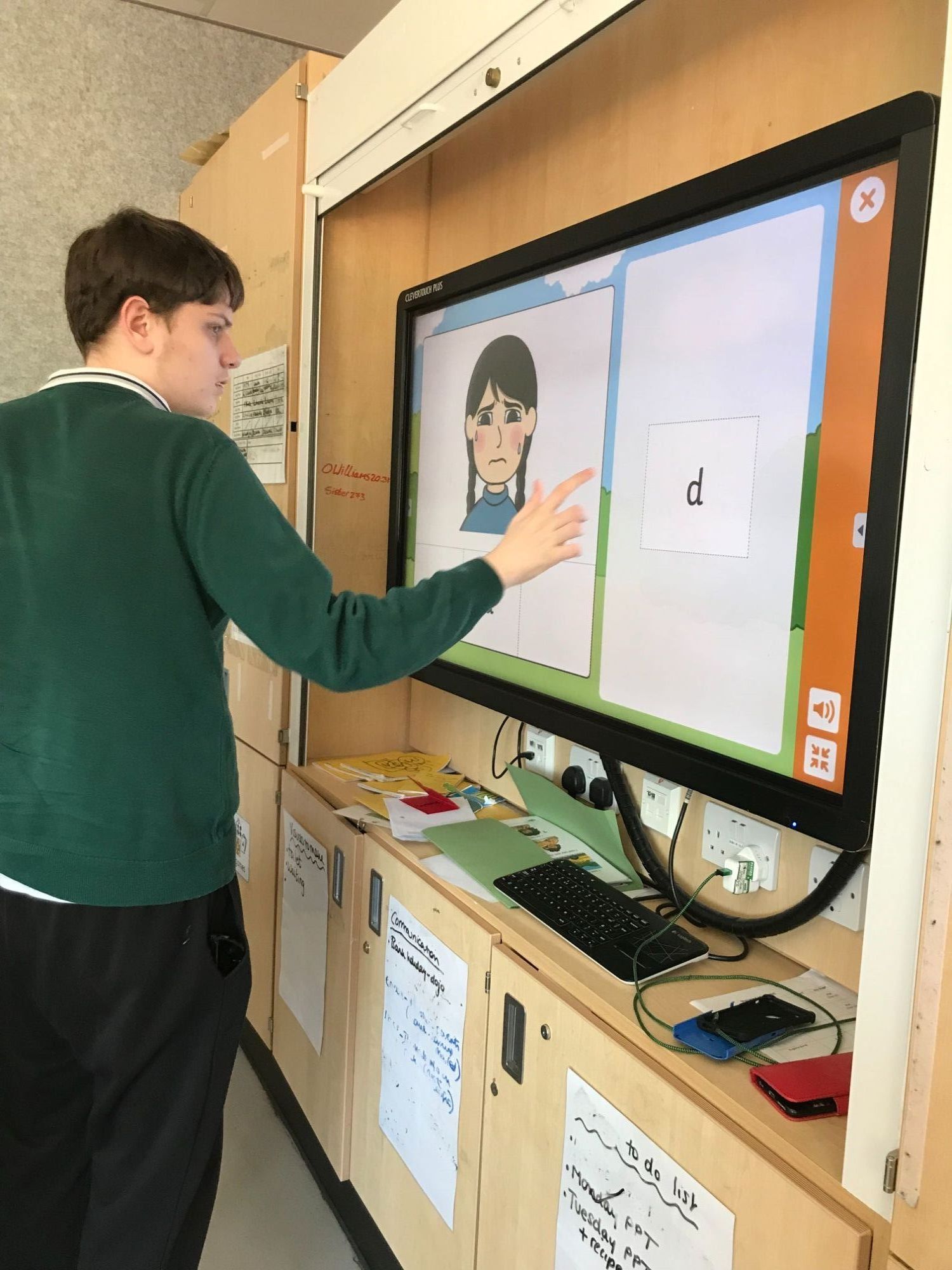 Pupil using interactive white board