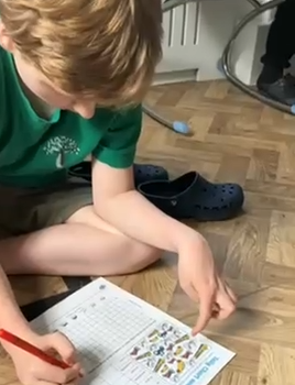 Pupil completing a statistics activity 