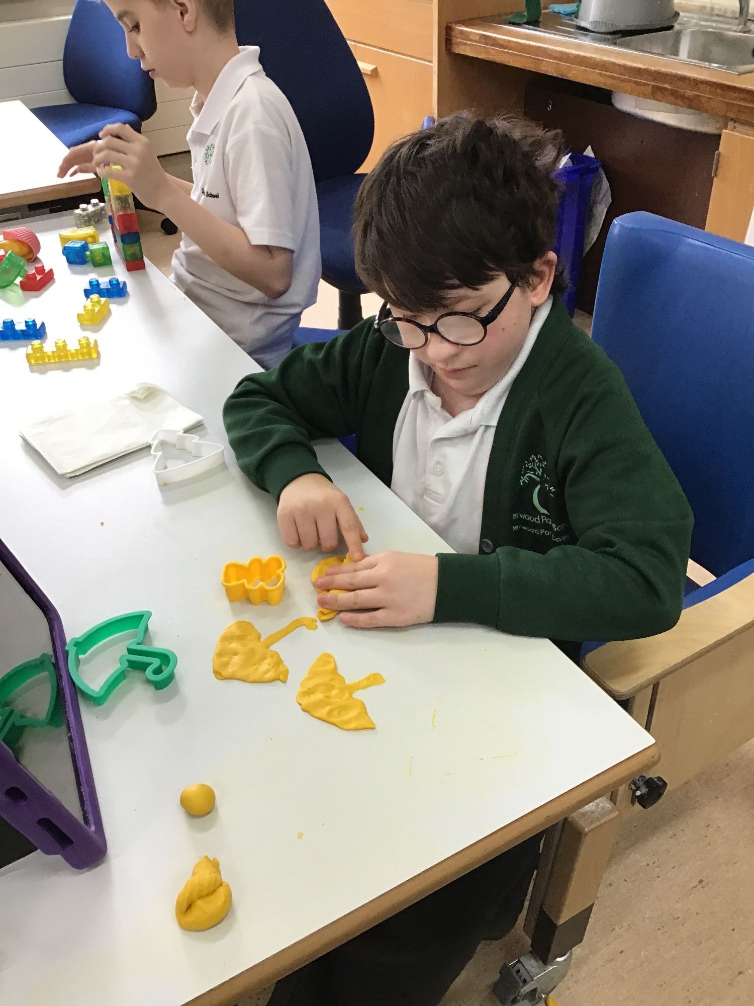 Pupils using lego and play dough in class 