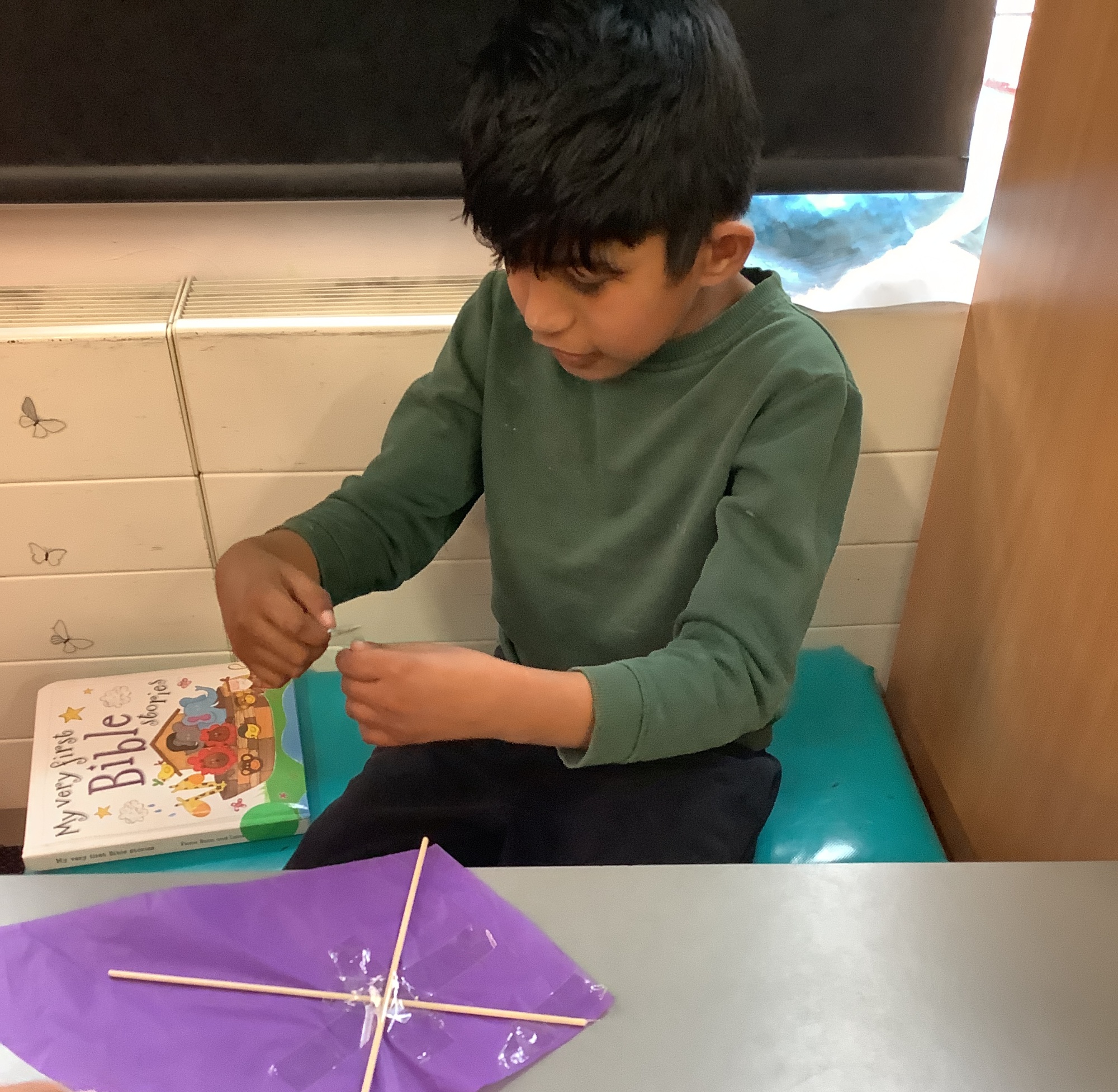 Pupil making a kite 