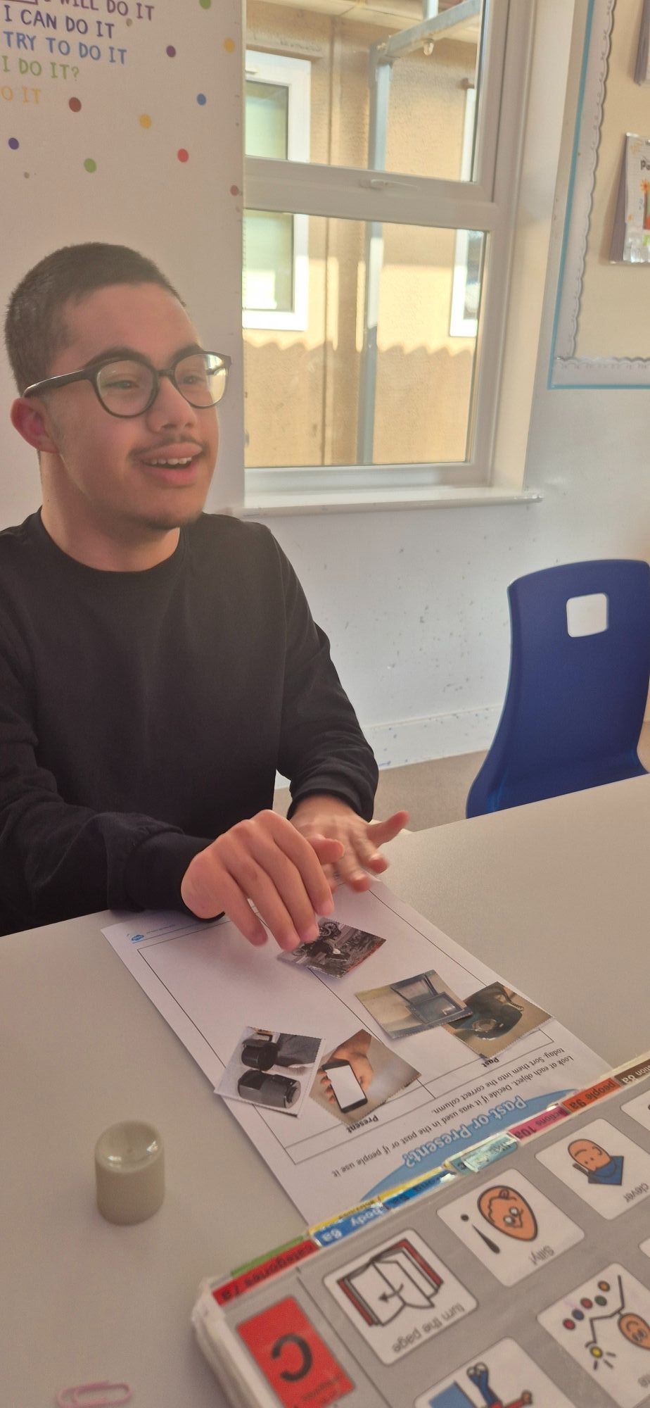 Pupil completing an activity with symbols in a classroom