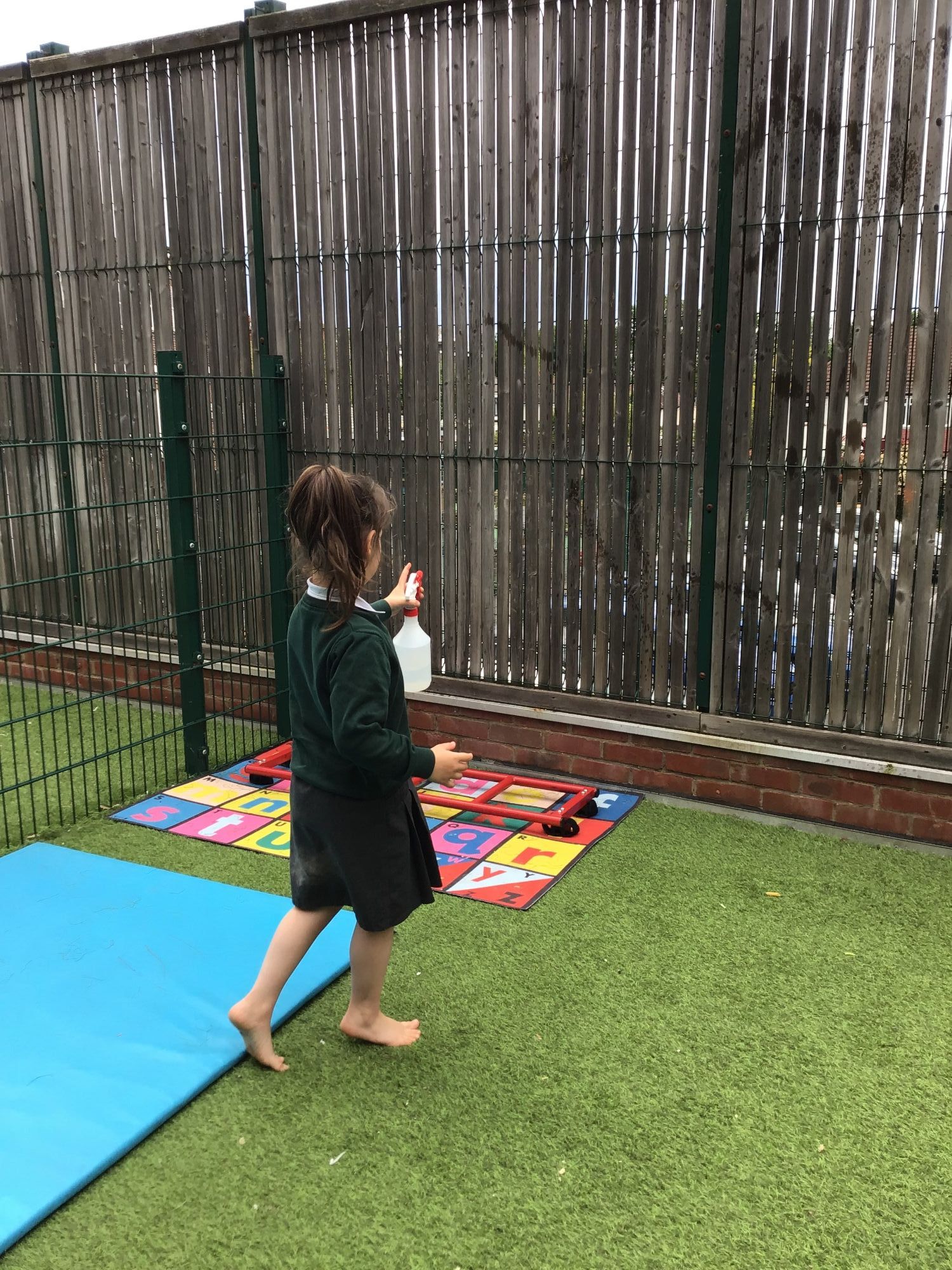 Pupil using water spray bottle 